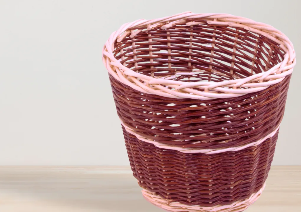 Handwoven wicker basket with pink and brown tones